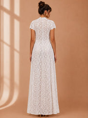 Embroidered White Lace Top in white floral lace with short sleeves, a fitted waist and a floor-length sheer hem
