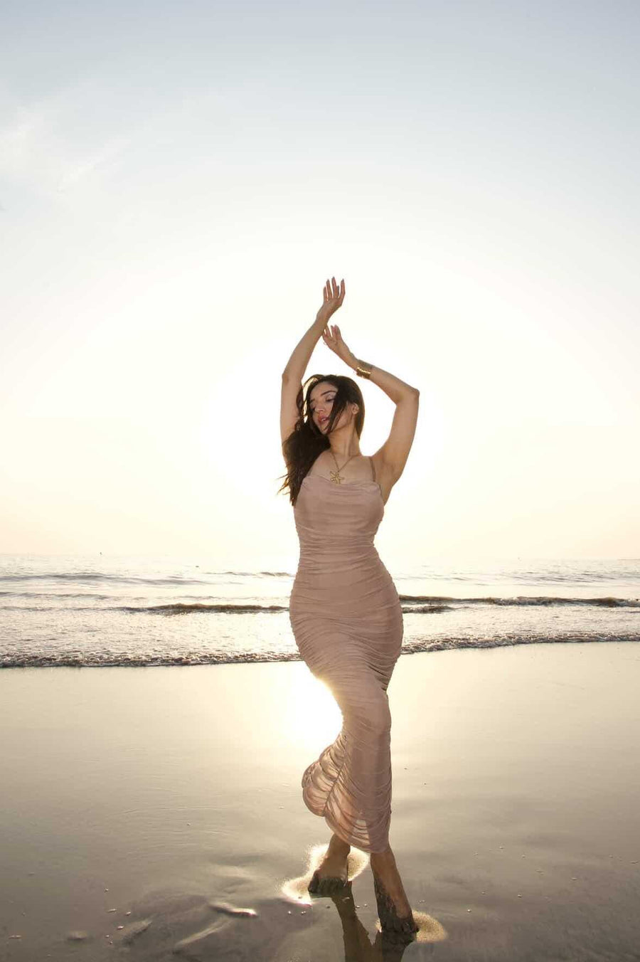 Moni Dress, beige sleeveless ruched bodycon dress with a fitted silhouette and floor-length hem