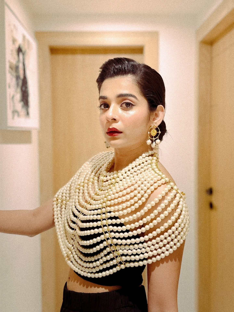 Pearl Cape Top in white with layered pearl strands draped over the shoulders and chest like a statement cape