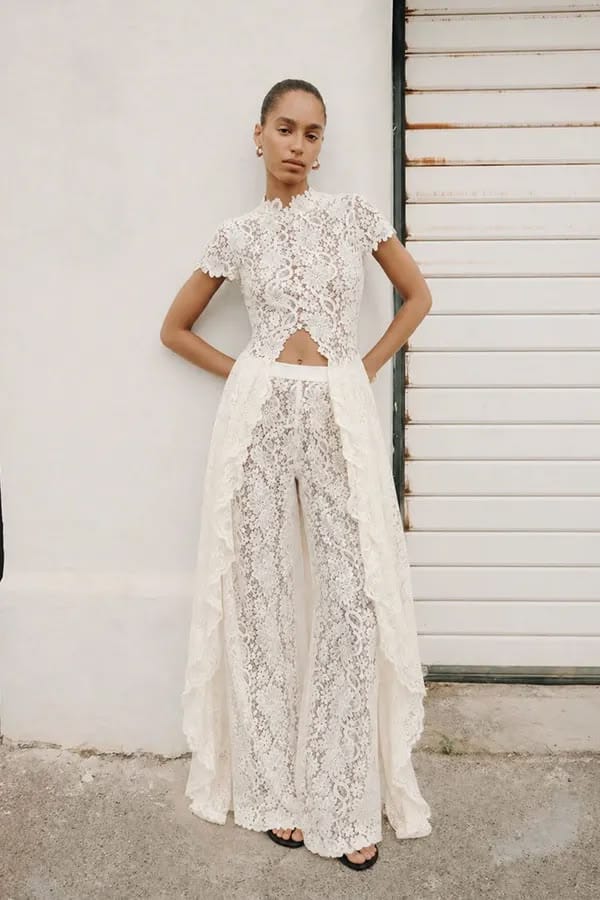 White Elegance Jumpsuit in ivory floral lace, with short sleeves, a waist cut-out and flowing wide legs