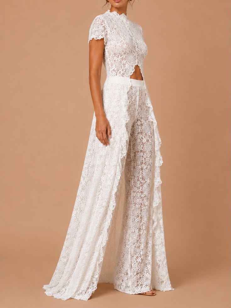 White Elegance Jumpsuit in floral lace with a high neckline, scalloped short sleeves, waist cut-out and wide legs