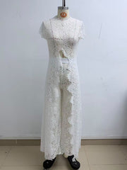 White Elegance Jumpsuit in white floral lace with short sleeves, a high neckline, waist cut-out and wide legs